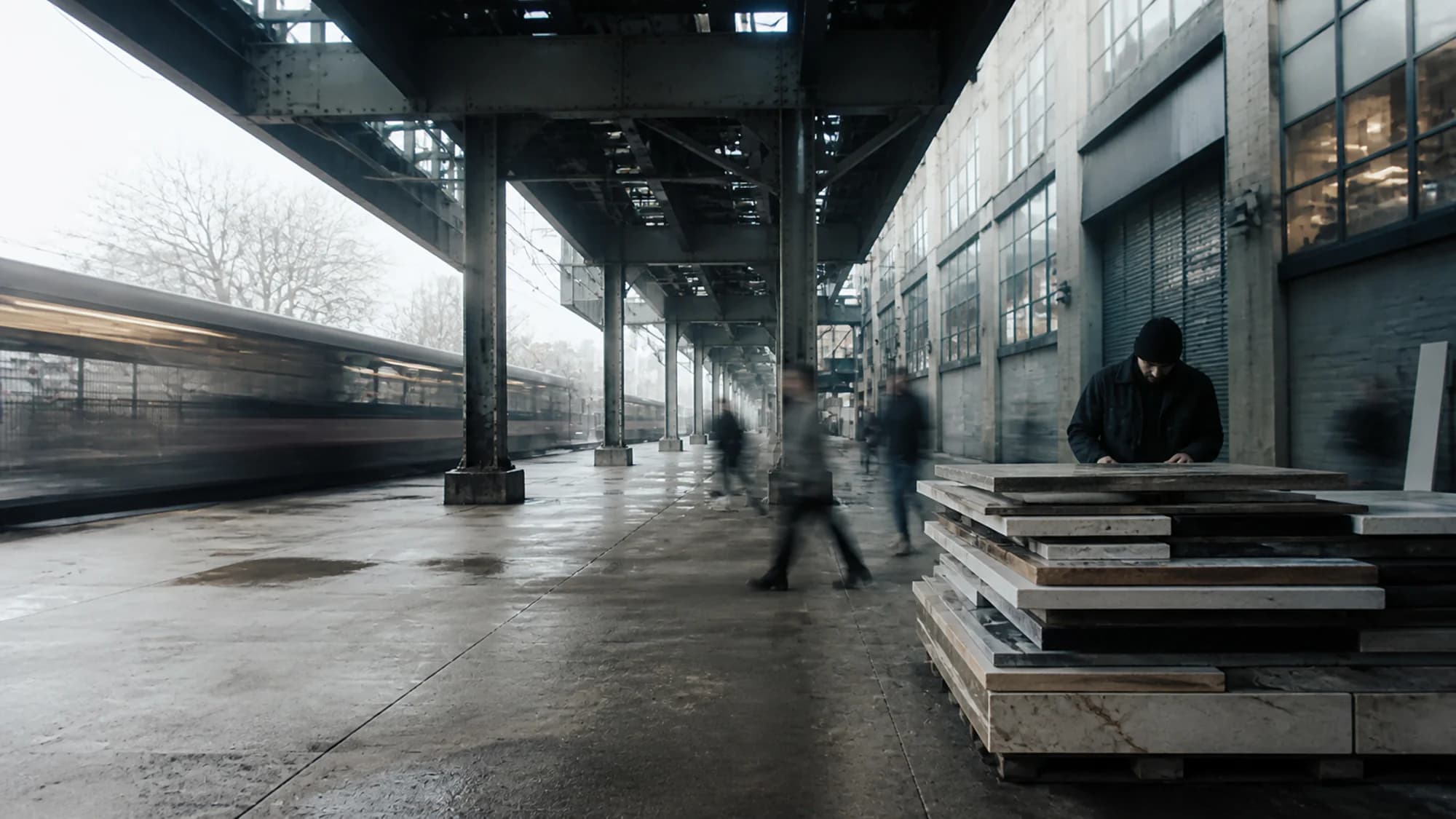 A maker working beneath the elevated railway in Queens, New York